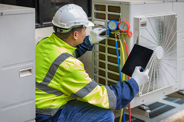 Professional Hvac technician working in Wenham, MA